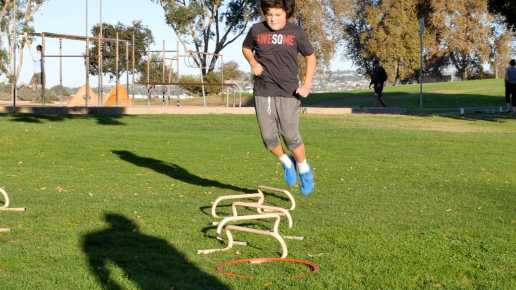 youth strength training San Diego coach working with teen athlete